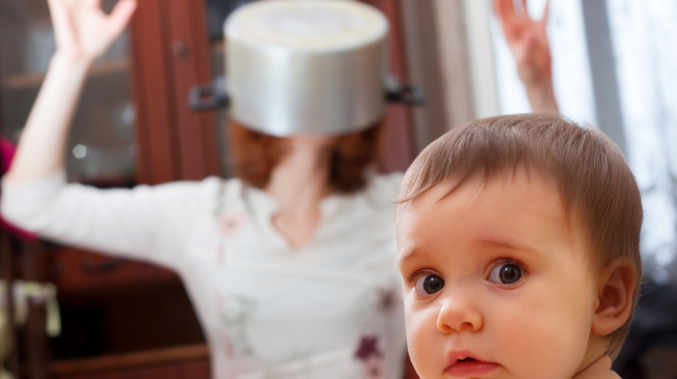 Portrait,Of,Scared,Baby,Against,Crazy,Mother,With,Pan,On